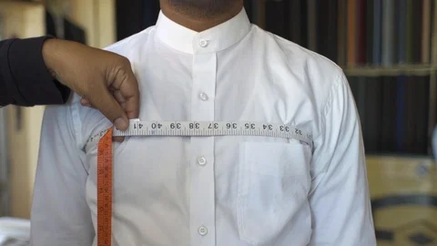 Tailor Measuring Width Of Man Chest. Stock Footage 113199579