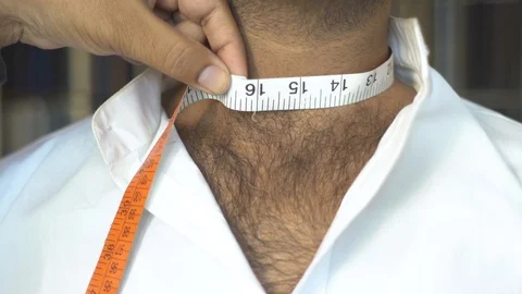 Tailor Measuring  Width Of Man Neck  With Measuring Tape Close-Up Stock Footage 113273430