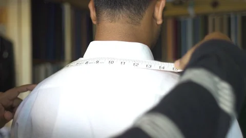 Tailor Measuring Width Of Man Shoulders Stock Footage 113199449