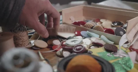 Tailor Picking Up Measuring Tape from Sewing Supplies Box Close Up Stock Footage 341936359