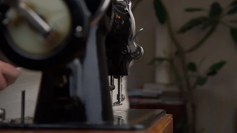 Tailor puts fabric under presser foot to keep material flat Stock Footage 127150507