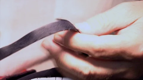 The tailor rips clothes with his hands Stock Footage 94149605