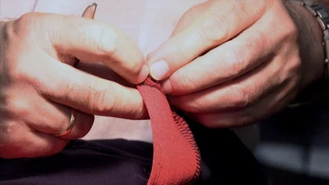 The tailor rips clothes with his hands Stock Footage 94150704