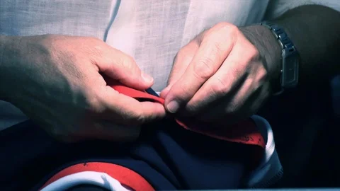 The tailor rips clothes with his hands Stock Footage 94160148