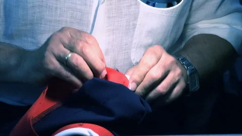 The tailor rips clothes with his hands Stock Footage 94160538