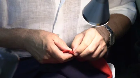 The tailor rips clothes with his hands Stock Footage 94160939