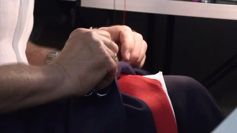 The tailor rips clothes with his hands Stock Footage 94162714