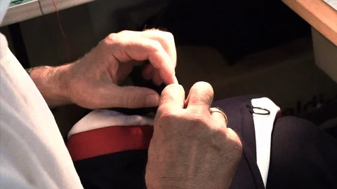The tailor rips clothes with his hands Stock Footage 94164328
