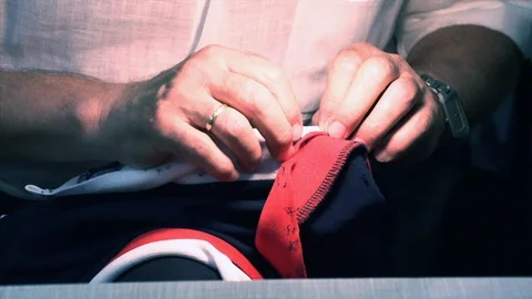 The tailor rips clothes with his hands Stock Footage 94305648