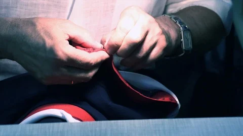 The tailor rips clothes with his hands Stock Footage 94313801