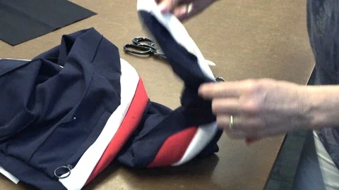 The tailor rips clothes with his hands Stock Footage 94409822