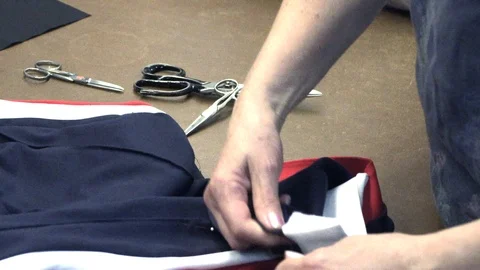The tailor rips clothes with his hands Stock Footage 94411049