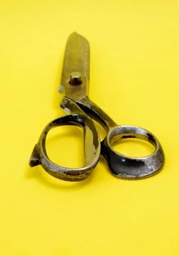 Tailor scissors on yellow background Stockfoto's