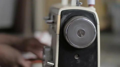 Tailor sew on sewing machine, close up with selective focus Stock Footage 156384121