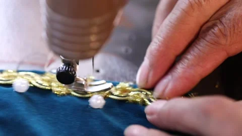 The tailor is sewing clothes with a sewing machine 2 Stock Footage 311645728