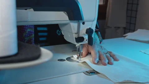 Tailor Sewing Fabric on Sewing Machine Close Up Stock Footage 329141396