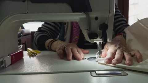 Tailor Sewing Fabric on Sewing Machine Close Up Stock Footage 329143116
