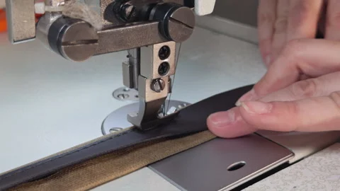 Tailor Sewing Fabric on Sewing Machine Close Up Stock Footage 329143772