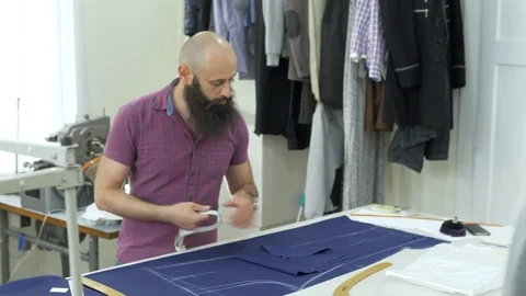 A tailor in a sewing workshop at work. Stock Footage 78123930