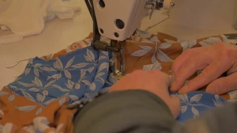 Tailor sews fabric with sewing machine Stock Footage 85048134
