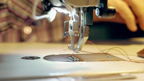 Tailor sews on the machine Stock Footage 100738523