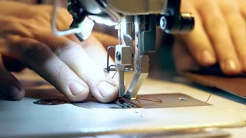 Tailor sews on the machine Stock Footage 105398191