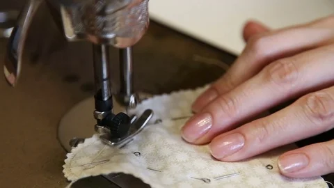 The tailor sews on the old sewing machine. Stock Footage 76050147
