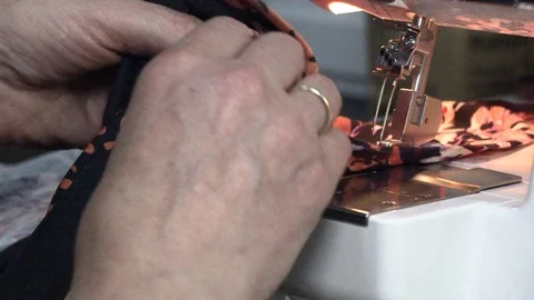 The tailor sews on the sewing machine Stock Footage 94242108