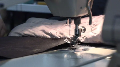 The tailor sews on the sewing machine Stock Footage 94351359