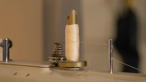 Tailor spool on a sewing machine turns 動画素材 119437882