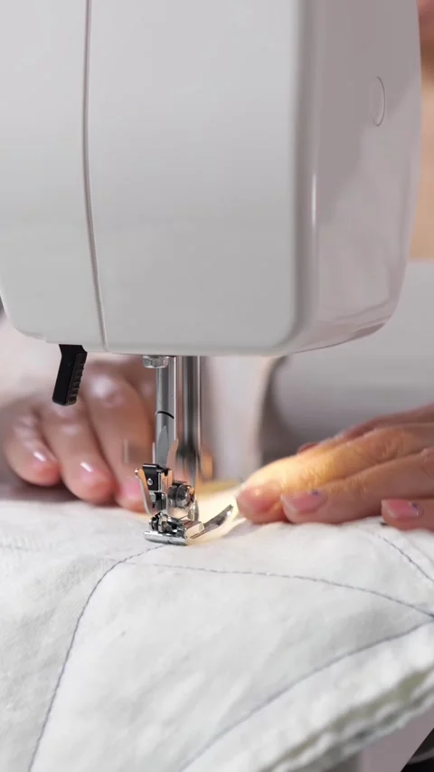 Tailor Stitches Padded Cloth Using Modern Electric Sewing Machine. Focused Maker Stock Footage 346989175