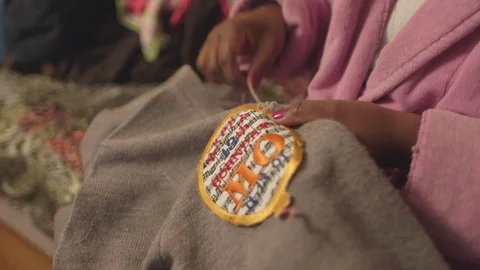 Tailor stitching badge on cloth Stock Footage 83885230
