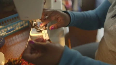 Tailor stitching cloth on sewing machine Stock Footage 83884320