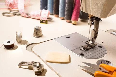 Tailor, tailoring table and utensils. Stock Photos