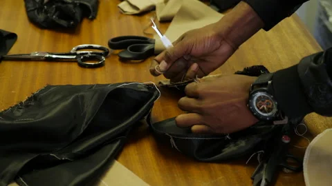 Tailor taking apart fabric. Stock Footage 138509549