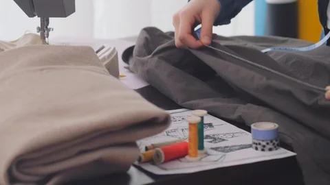 Tailor taking measure and cutting material. Stock Footage 122187366