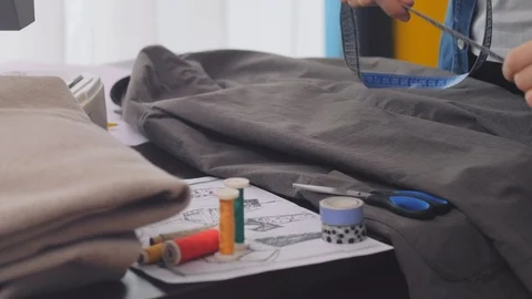 Tailor taking measure and cutting material. Stock Footage 122187571