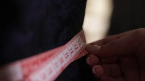 The tailor is taking measurements 3 Stock Footage 320502144