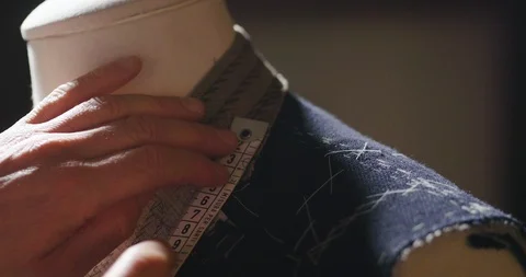 A tailor taking a measures of for a new handmade great quality suit  in atelier. Stock Footage 115130073