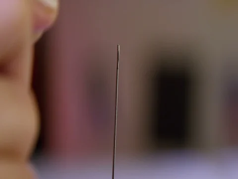 Tailor threading a needle 36 Stock Footage 84114571