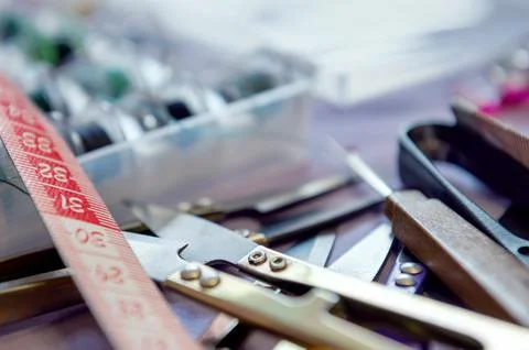 Tailor tools. Crafting essentials for sewing projects on a table with threa.. Stock Photos