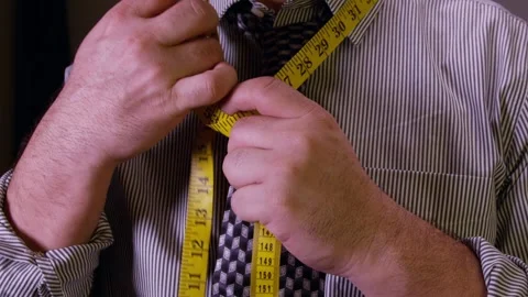 Tailor Tying A Knot With Measuring Tape Stock Footage 243607629