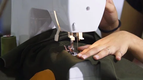 Tailor is using sewing machine Stock Footage 99036571