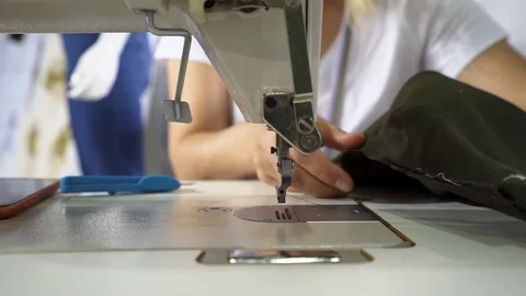 Tailor is using sewing machine Stock Footage 99036653