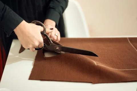 Tailor at work, drawing line on fabric with chalk Stock Photos