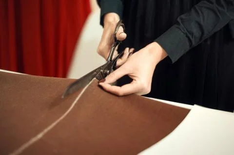 Tailor at work, drawing line on fabric with chalk Stock Photos