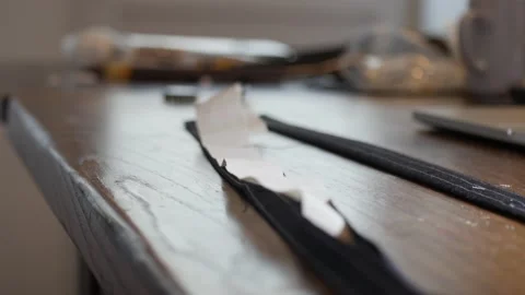 Tailor at work : Professional tailor stuffing garment for bespoke trousers. on Stock Footage 138736057
