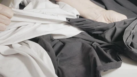 Tailor at work ripping used fabric Stock Footage 344927867