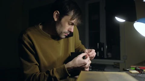 Tailor work in workshop and talking on smartphone. Stock Footage 150156830