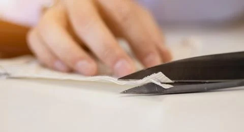 Tailor working in atelier. Photos